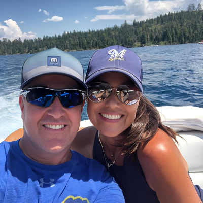 Alecia Yelich taking a picture with her husband Stephen.